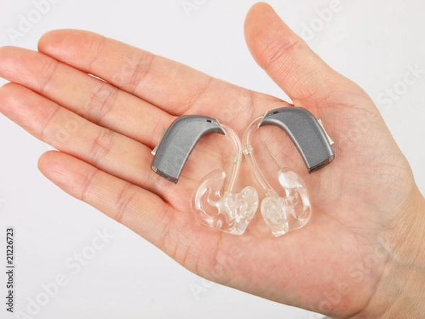 Obraz Hand holding hearing aid