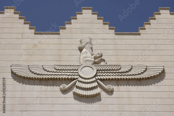 Obraz Faravahar symbol on a facade of the building in Kermanshah, Iran