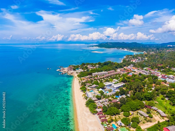Fototapeta Aerial view of beautiful tropical beach and sea with palm and other tree in koh samui island