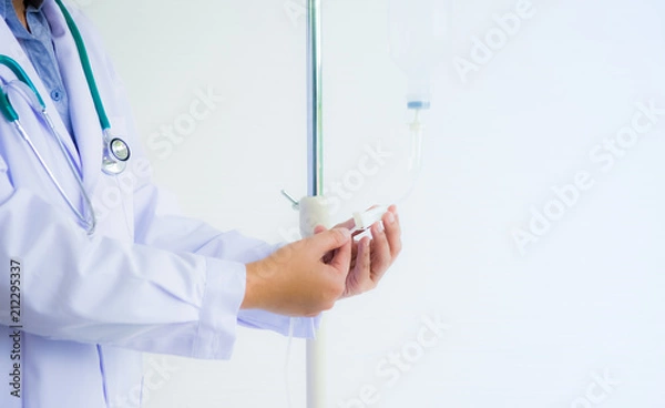Fototapeta Doctor is adjusting rate of intake salt solution for recovery patient