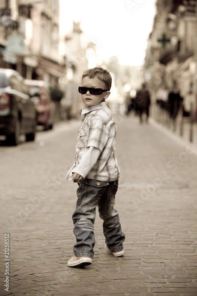 Fototapeta A young boy struts his stuff