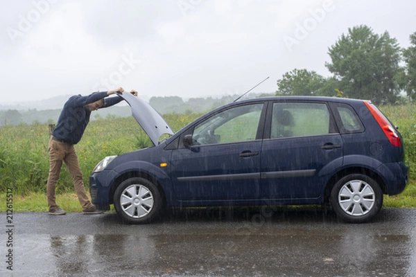 Fototapeta Car trouble. Engine failure in rain