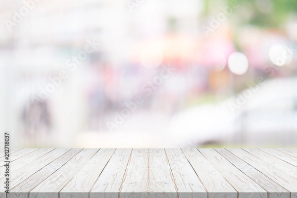 Fototapeta white wood table top on blurred background from shopping mall, Space for montage your product