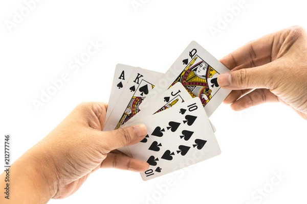 Fototapeta Hand of man is holding spade straigt flush isolated