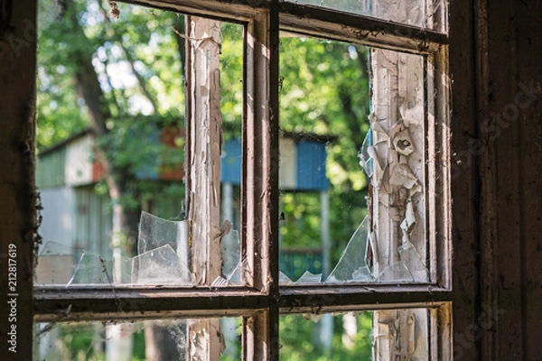 Obraz completely broken glass in old wooden windows