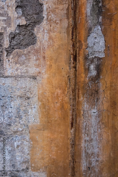 Fototapeta Vertical image of worn concrete wall. Peeling plaster on a cement wall.