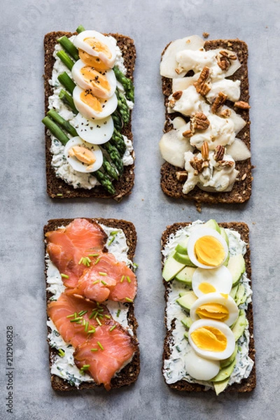 Obraz Four different toasts with smorrebrod toppings