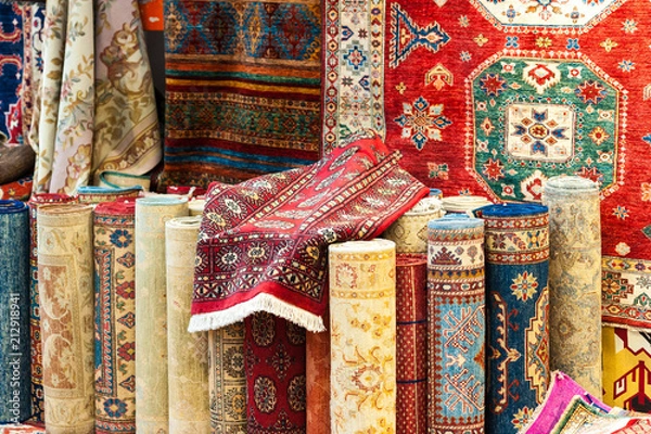 Obraz Carpets variety selection rolled up rugs shop store.