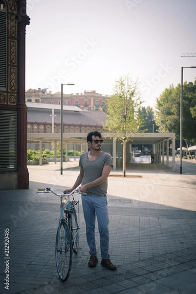 Obraz man with a vintage bicycle