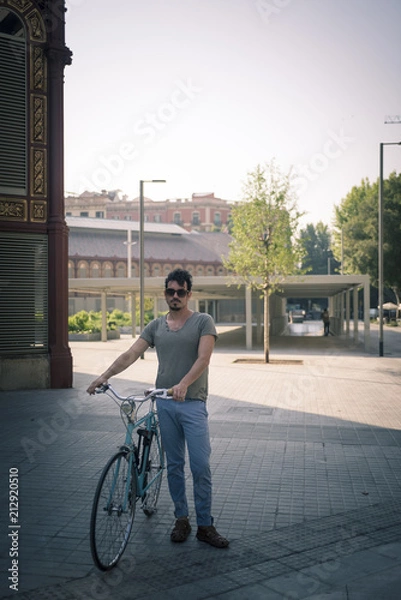 Obraz man with a vintage bicycle