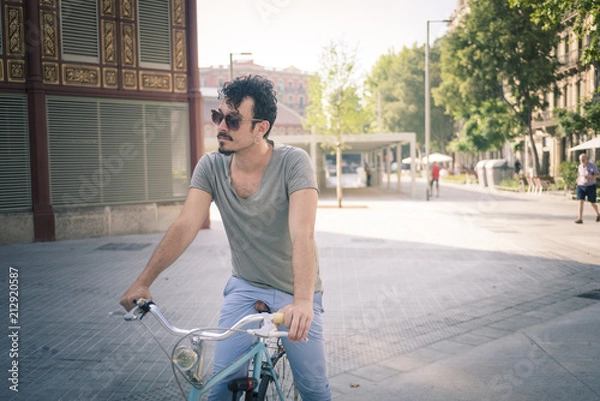Obraz man with a vintage bicycle