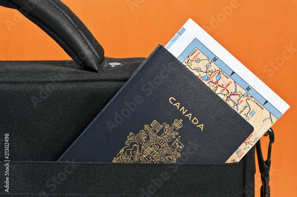 Fototapeta Canadian passport, map and suitcase.