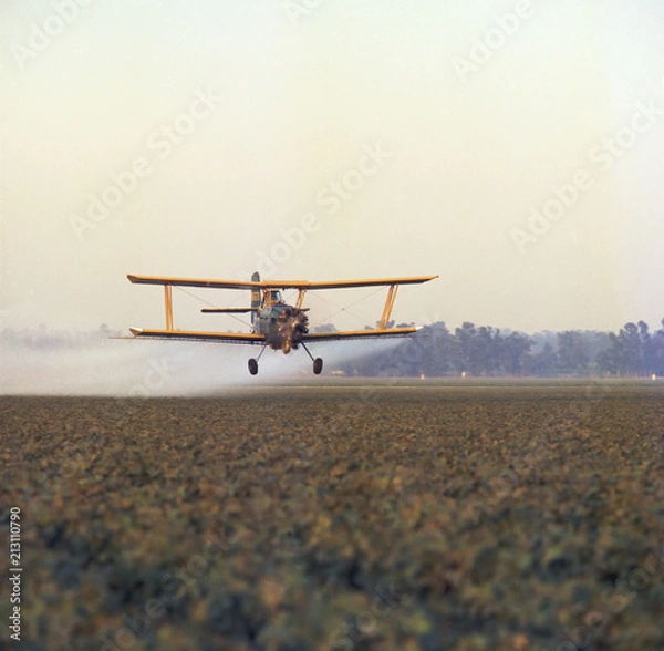 Obraz Biplane crop dusting