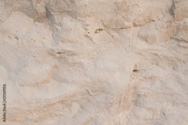 Fototapeta Closeup limestone rock face showing weathered strata Geology walpaper or background