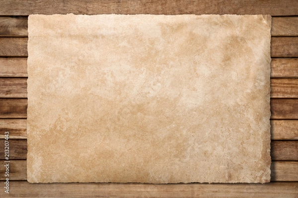 Fototapeta Old paper sheet at wooden background with clipping path
