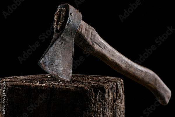 Fototapeta  close up view of vintage axe on wooden stump isolated on black