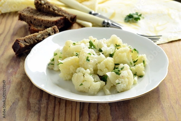 Obraz Cauliflower with garlic and parsley in lemon sauce