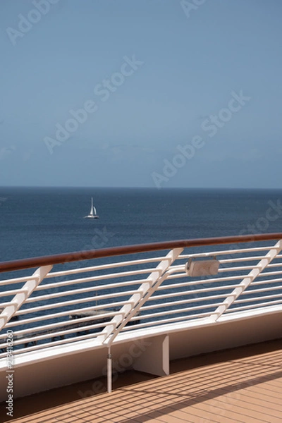 Fototapeta Cruise Ship Deck with Sailboat Vertical