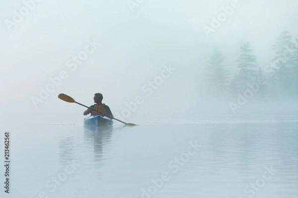 Obraz Senior Solo Traveling Man Kayaking in Dense Fog in Wilderness Waters