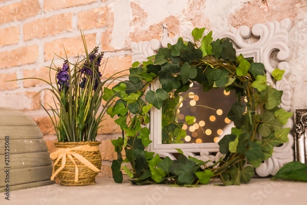Fototapeta vintage wooden rectangular white frame with green plant. Floral scene