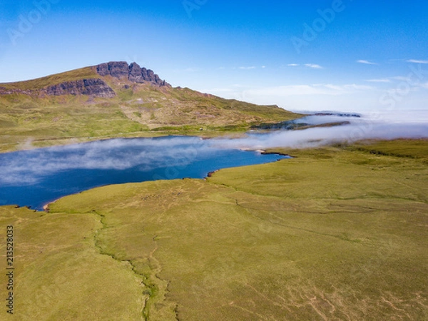 Fototapeta A low level mist rolls over a loch on The Isle Of Skye
