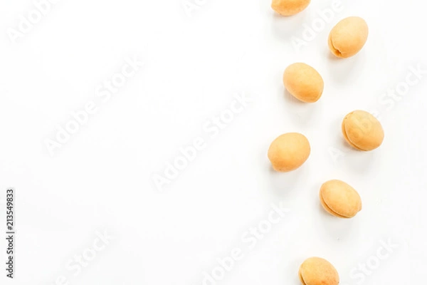 Fototapeta Yellow apricots on white background. Flat lay, top view fruit concept.