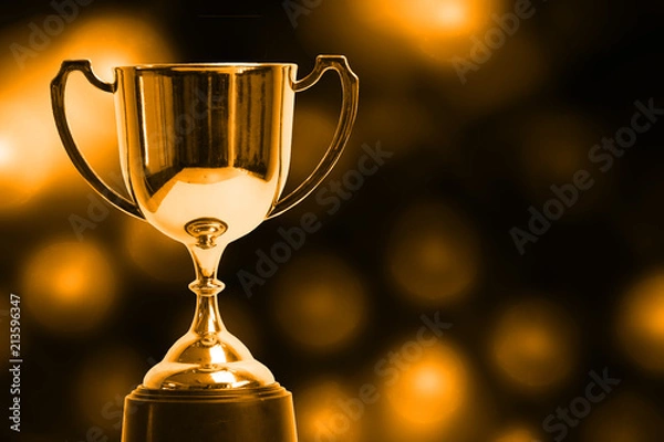 Obraz Winner trophy with abstract bokeh light background.