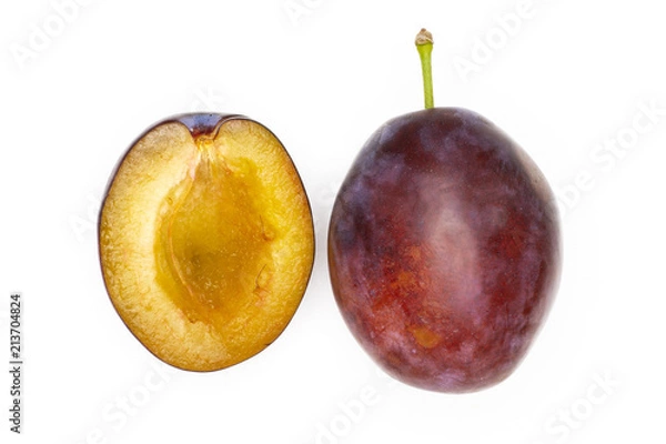 Fototapeta Group of one whole one half of fresh violet-blue plum vibrant moyer variety flatlay isolated on white