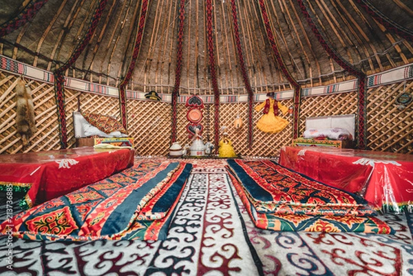 Fototapeta National traditional decoration of the yurt ceiling. Kazakhstani ornament. Vintage weaving of patterns. Yurt decoration. Wooden frame with patterns as an ethnic background, golden horde, Kazakhstan.