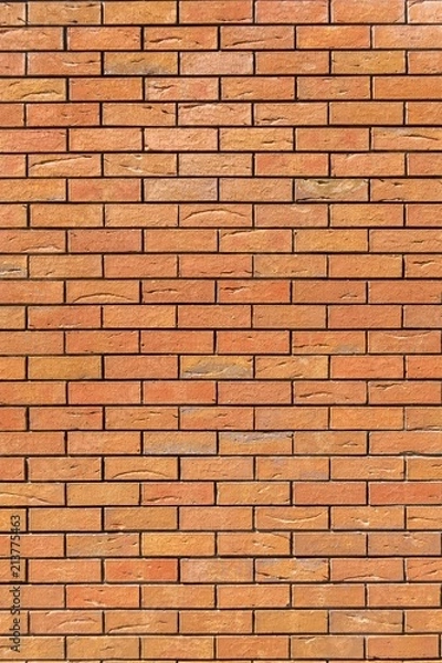 Obraz Red brick wall. Decorative brick with artificial defects and cracks. Vertical view