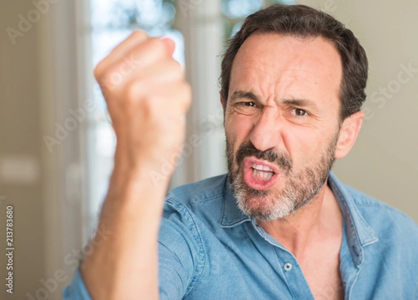 Obraz Handsome middle age man annoyed and frustrated shouting with anger, crazy and yelling with raised hand, anger concept