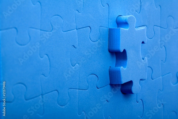 Obraz 3D blue puzzle on blue background.
