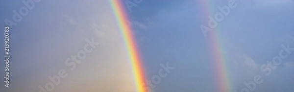 Fototapeta double, beautiful, multi-colored rainbow after passing a spring downpour