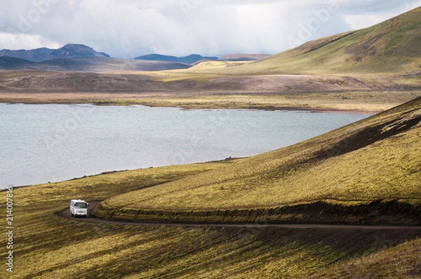 Obraz Bus drives on a dirt road near Frostastadavatn Lake in Landmannalaugar (Rainbow Mountains), Iceland