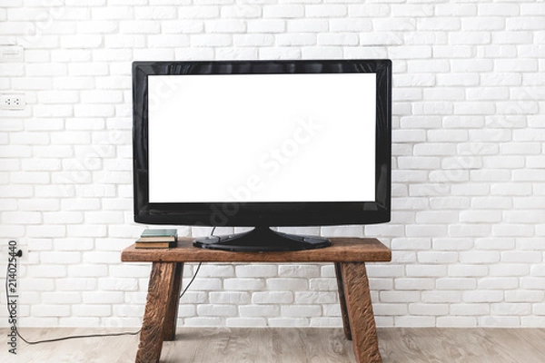 Obraz Empty white flat TV screen hanging on a white wall.
