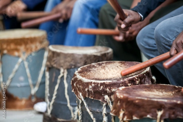 Obraz Drums being hit with sticks. The drum skins are made from cow hide.