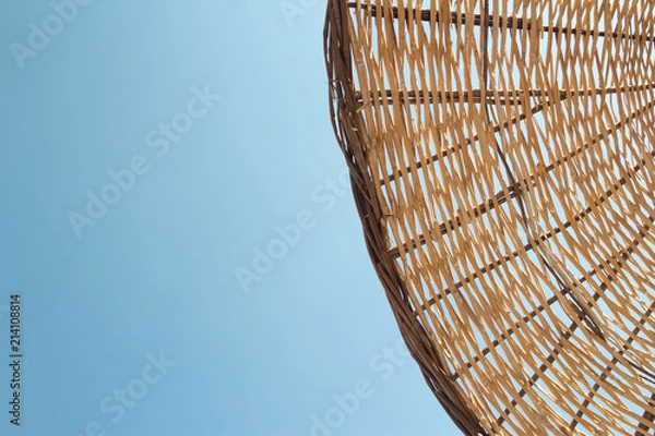 Fototapeta Straw umbrella closeup texture in the daylight