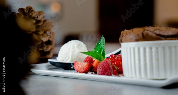 Obraz Ice cream with strawberries, mousse dessert served at restaurant