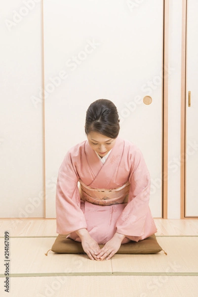 Obraz 着物を着てお辞儀をする女性