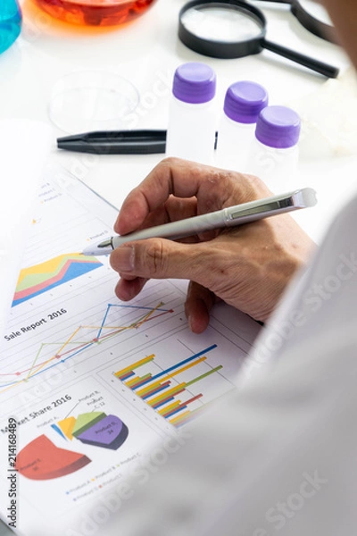 Fototapeta Scientists are writing reports.