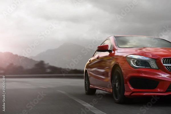 Obraz czerwony samochód biznesu przyspieszenie na górskiej autostradzie z rozmyciem ruchu