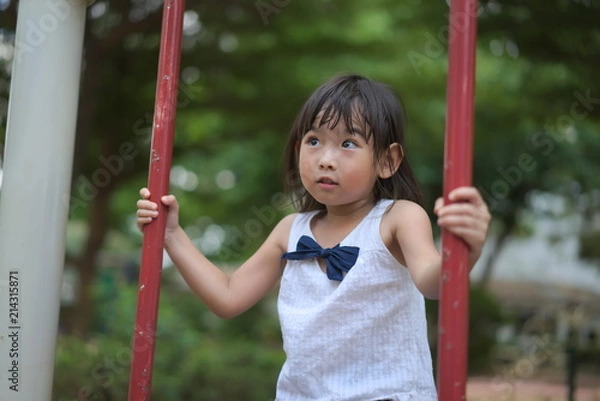 Obraz Portrait Asian little girl Playing the playground	