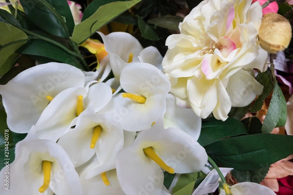 Obraz Beautiful multicolored artificial flowers background. Fake fabric flowers decor.