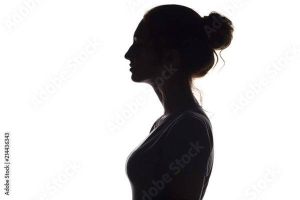 Fototapeta silhouette profile of beautiful girl on a white isolated background