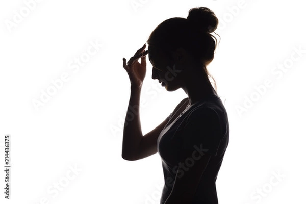 Fototapeta silhouette profile of a young woman on a white isolated background
