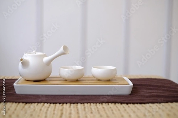 Obraz Tea pot with cups on table