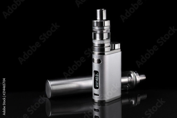Fototapeta electronic cigarette or vaping device on black background