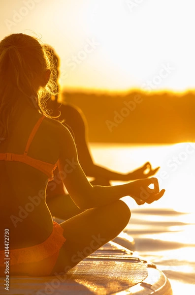 Obraz Yoga auf dem Stand Up Paddle Board