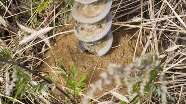 Obraz Geotechnical drilling for soil samples (pre construction industrial work)