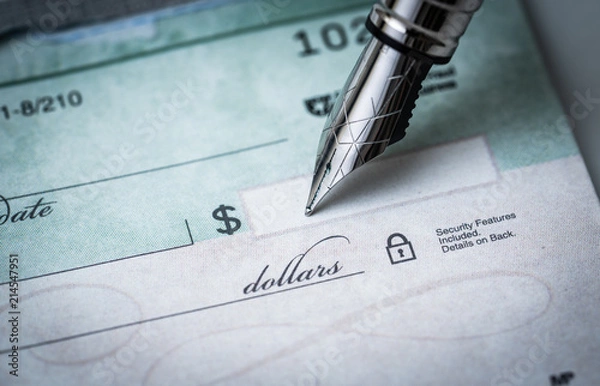 Obraz writing a check , making payments